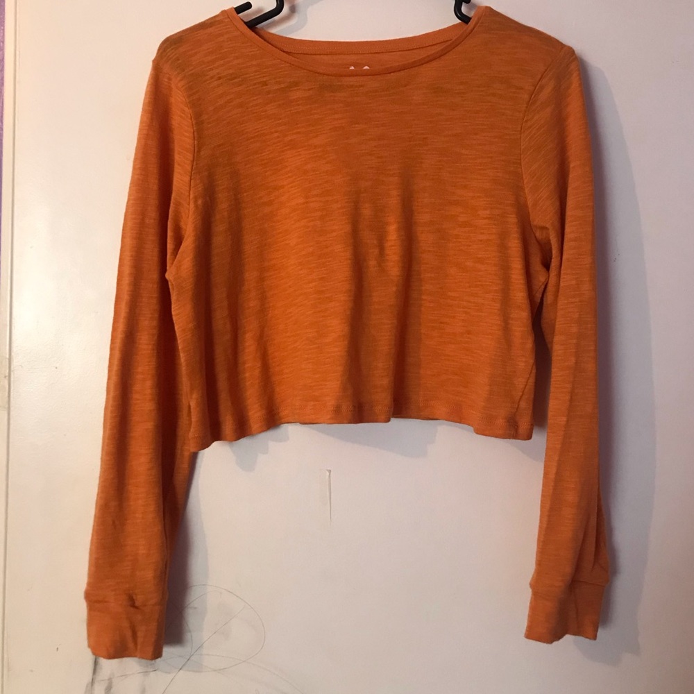 orange cropped long sleeve shirt